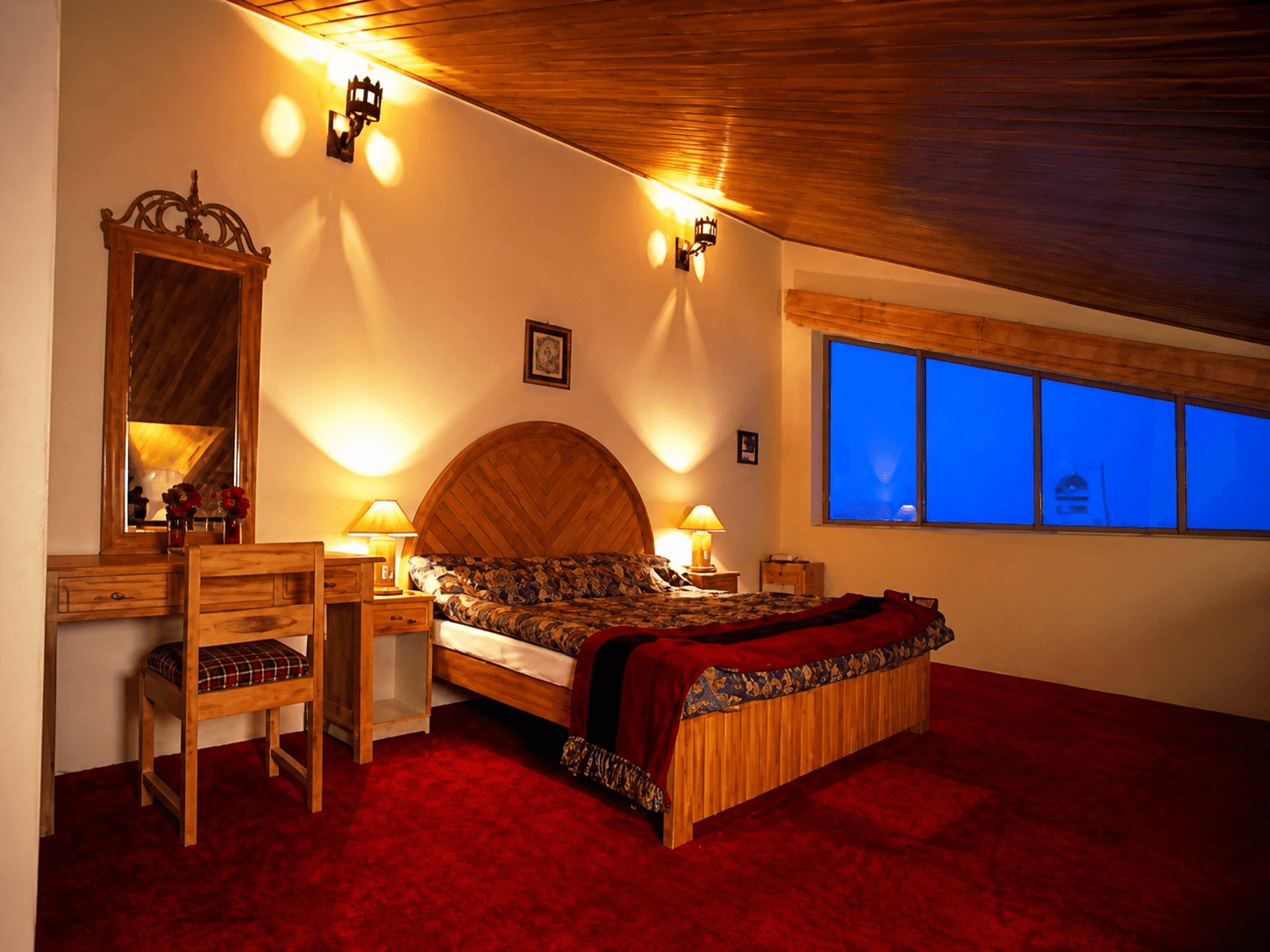 Warmly lit guest room at Cliff Top Club